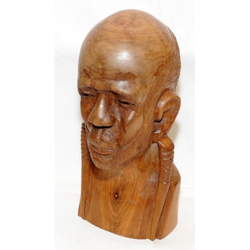 296 - Large and heavy African art wooden carved male bust. 37cms tall