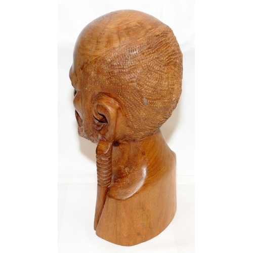 296 - Large and heavy African art wooden carved male bust. 37cms tall