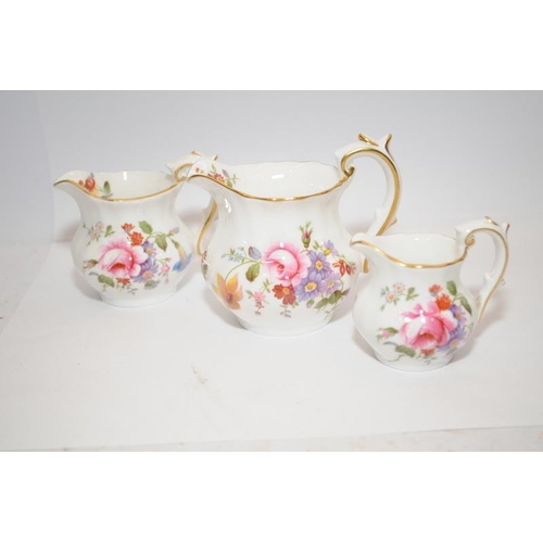 312 - Royal Crown Derby set of three miniature jugs in the Derby Posies pattern c/w a Pierre Redoute jug 1... 