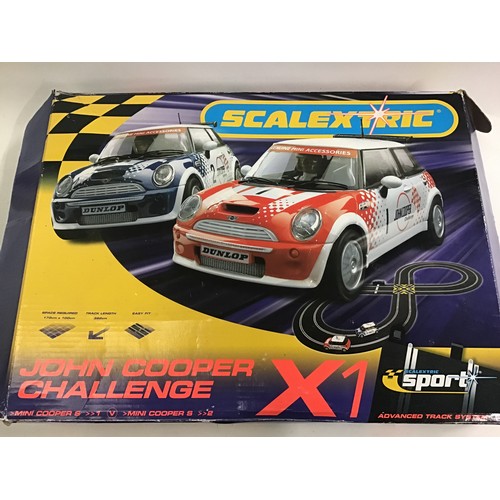 243 - 5 boxes of various racing car games to include Scalextric.