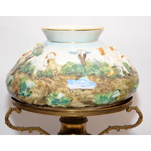 324 - A vintage Capo di Monte ceramic lamp base with applied cherubs and foliage a/f. O/all height 52cms.