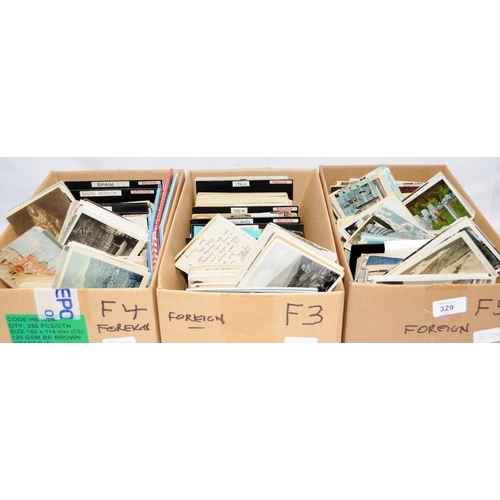 329 - 4000 vintage foreign postcards contained in a number of boxes