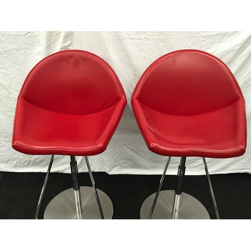 233 - A pair of red Cattelan Italia Kiss gas lift stools.