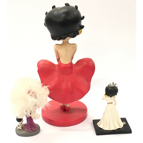 258 - Betty Boop bobble head figurine 20cm tall together with two miniature Betty Boop figures (3).