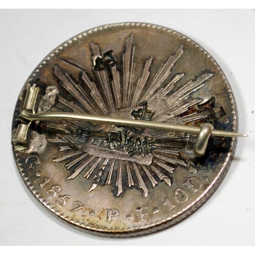 24 - Japan 1857 trade dollar mounted as a brooch