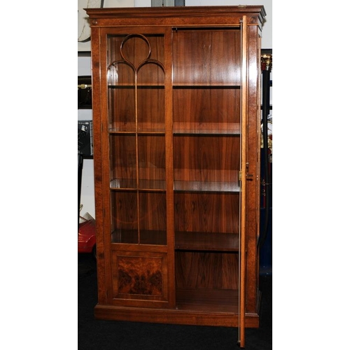 4 - Tall walnut veneer glazed two door display unit with interior lighting. Glazed panels to front and b... 