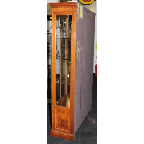 4 - Tall walnut veneer glazed two door display unit with interior lighting. Glazed panels to front and b... 