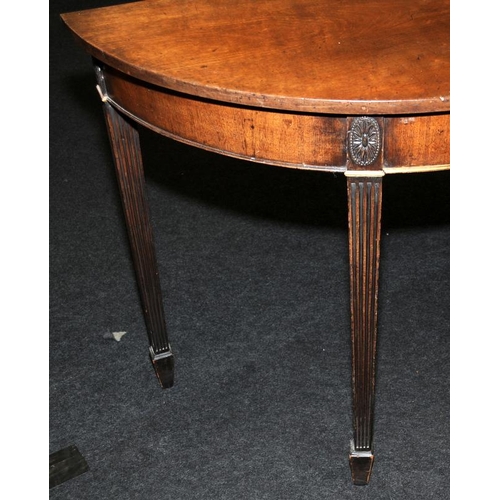 491 - Edwardian demi-lune table on tapered reeded legs. 81cms tall x 114cms wide x 52cms deep