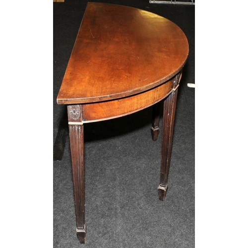 491 - Edwardian demi-lune table on tapered reeded legs. 81cms tall x 114cms wide x 52cms deep