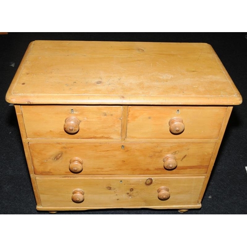 492 - Victorian 2 over 2 chest of pine drawers on bun feet. 77cms tall x 84cms wide x 46cms deep