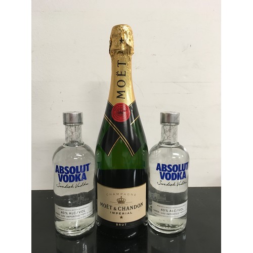 1 - A 750ml bottle of Moët together with two 350ml bottles of absolut vodka. (2,1)