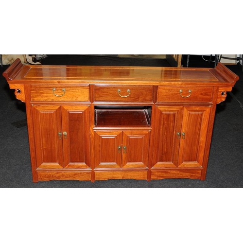 494 - Chinese style hall table with three drawers over cupboards. 148cms wide x 81cms tall x 35cms deep