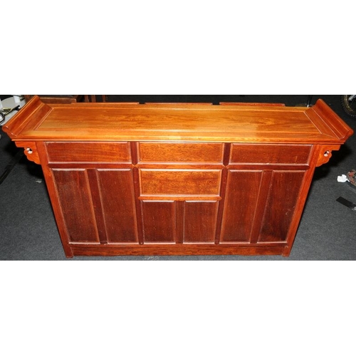 494 - Chinese style hall table with three drawers over cupboards. 148cms wide x 81cms tall x 35cms deep