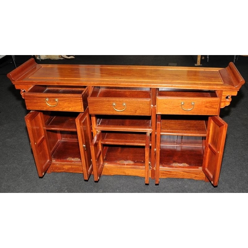 494 - Chinese style hall table with three drawers over cupboards. 148cms wide x 81cms tall x 35cms deep