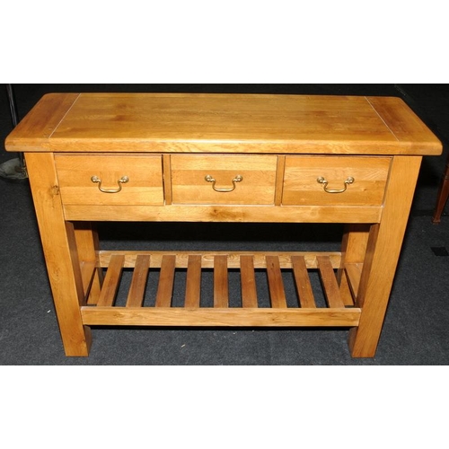 495 - Quality light oak dresser base, three drawers over pot board. 118cms wide x 85cms x 40cms.