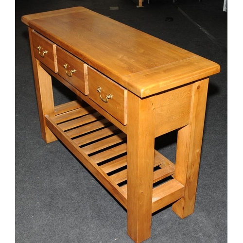 495 - Quality light oak dresser base, three drawers over pot board. 118cms wide x 85cms x 40cms.