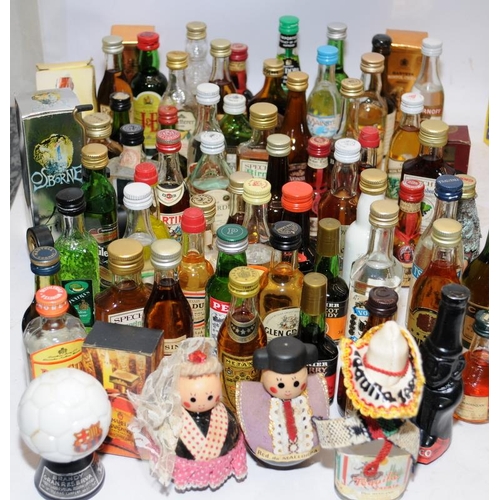 32 - A very large collection of vintage spirits miniatures including collectable examples. All seals inta... 