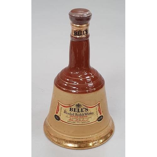 34 - Bells Wade porcelain whisky decanter sealed 75cl.