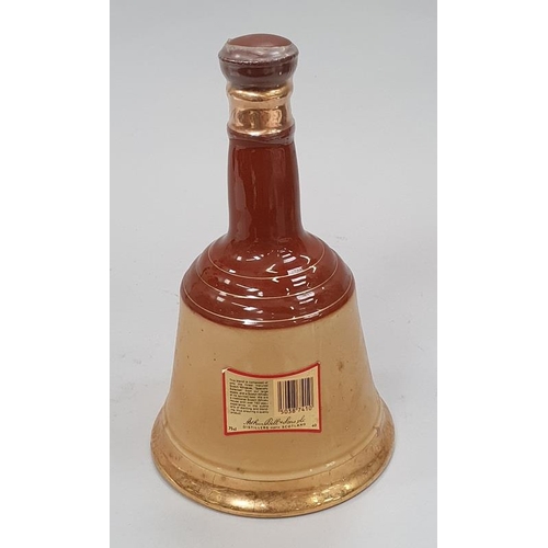 34 - Bells Wade porcelain whisky decanter sealed 75cl.