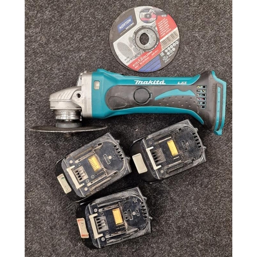 124 - A Makita disc cutter and 3 batteries (36)