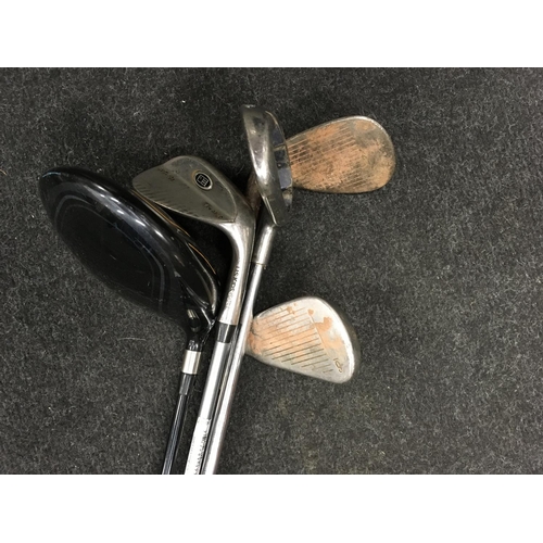 198 - Various golf clubs. (H43)