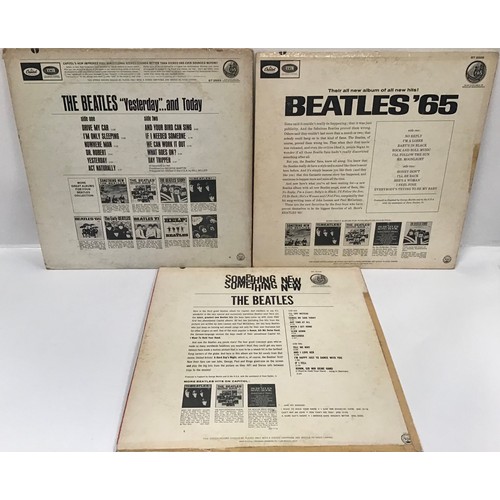 75 - 3 USA VINYL BEATLES ALBUMS. Title's here include - 'Yesterday & Today' on Capitol ST 2553 - 'Somethi... 