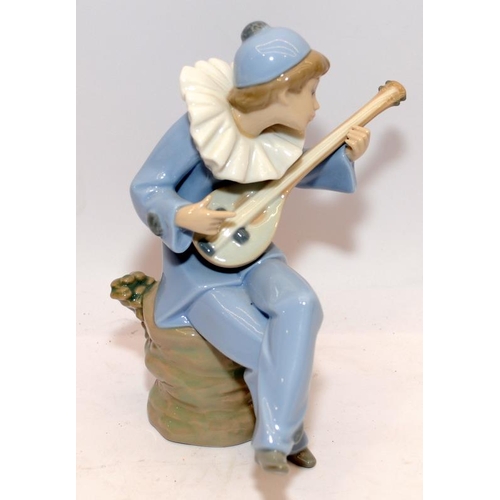 32 - Nao by Lladro figure of a girl playing a lute. 19cms tall