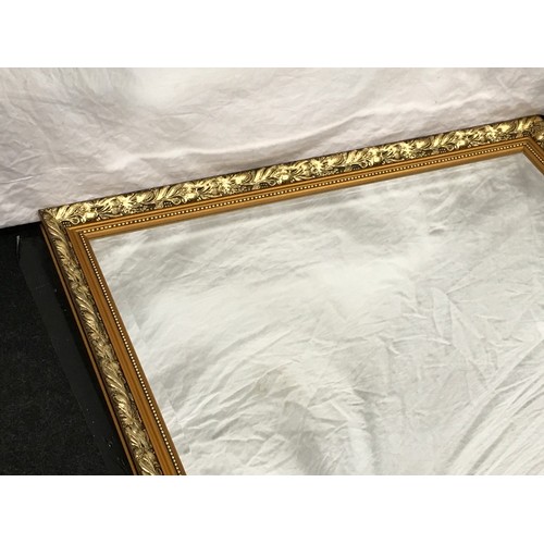 176 - Contemporary gilt framed large over mantle mirror with bevelled edged glass 112x87cm.