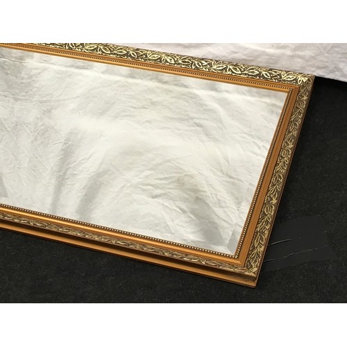 177 - Contemporary gilt framed over mantle mirror with bevelled edged glass 97x69cm.