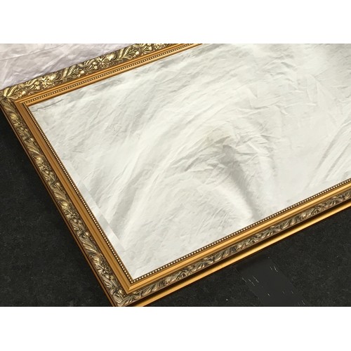 178 - Contemporary gilt framed over mantle mirror with bevelled edged glass 97x69cm.