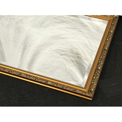 178 - Contemporary gilt framed over mantle mirror with bevelled edged glass 97x69cm.