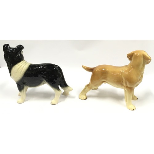 38 - Two ceramic dog ornaments.