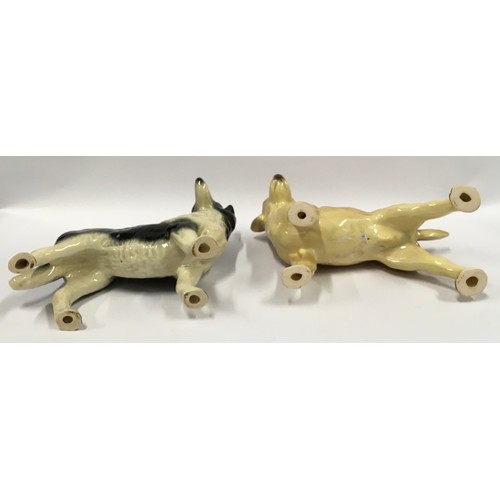 38 - Two ceramic dog ornaments.