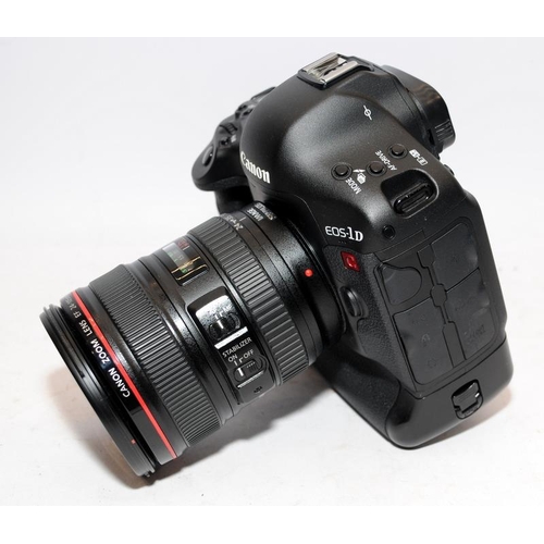 1 - Canon EOS-1D C DSLR camera with fitted Canon EF 24-105 1:4 zoom lens. With two batteries and a twin ... 