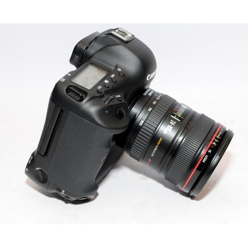 1 - Canon EOS-1D C DSLR camera with fitted Canon EF 24-105 1:4 zoom lens. With two batteries and a twin ... 