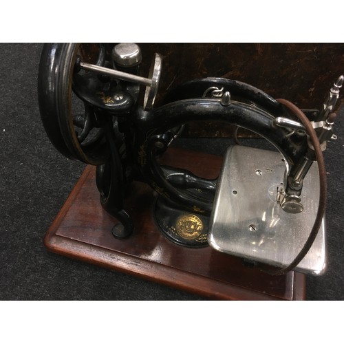 14 - Antique Wilcox & Gibbs sewing machine complete with original wooden case.