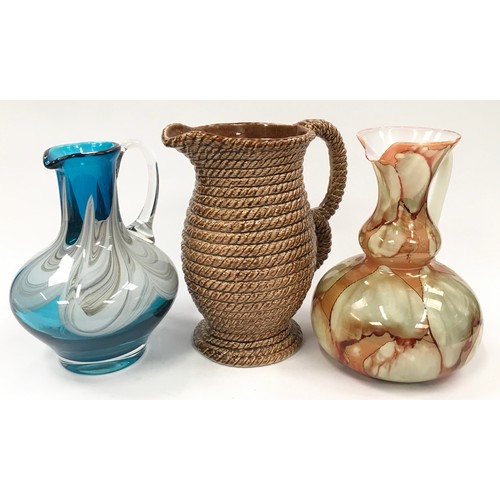 101 - Collection of jugs to include two glass examples and a ceramic rope effect (3).