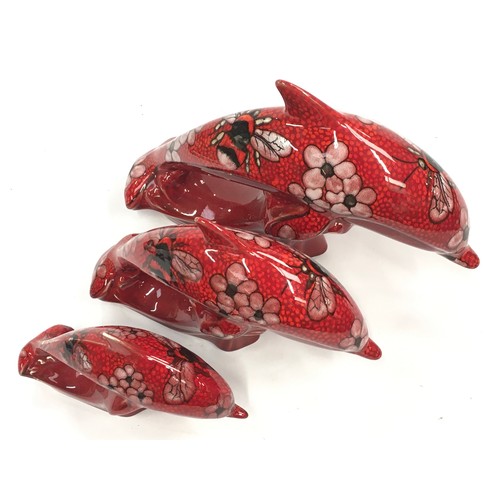 337 - Poole Pottery set of three graduated Dolphins decorated with Bees & Flowers by Nicola Massarella (3)