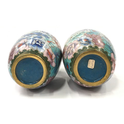 119 - Pair of oriental cloisonne vases each measuring 19cm tall.