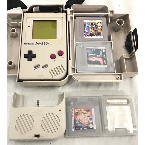 580 - GAMEBOY WITH GAMES. Comes with a Gameboy carry-all plus Games.