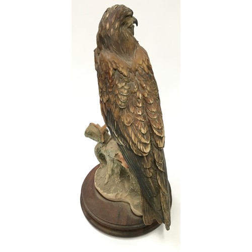 58 - Giuseppe Armani large hawk figure on wooden base 39cm tall.