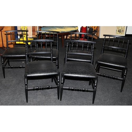 476 - A set of six black Italian designer dining chairs.