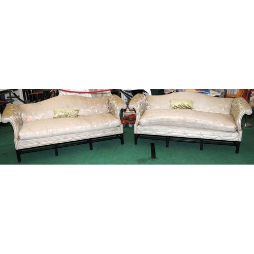 479 - Two camel back sofas in a patterned upholstery each 90x215x90cm.