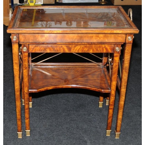 482 - A Neoclassical style burr walnut veneer table featuring classical tapered legs with brass feet and a... 