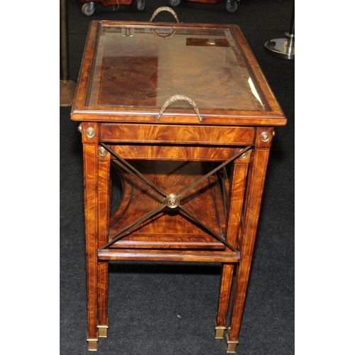 482 - A Neoclassical style burr walnut veneer table featuring classical tapered legs with brass feet and a... 