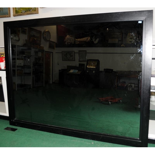 484 - A very large smoked glass ebonised oak framed mirror 247x188cm.