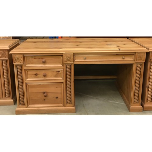 458 - Solid pine desk with 3 side draws and a central draw turned up supports and carved motif decoration ... 