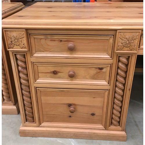 458 - Solid pine desk with 3 side draws and a central draw turned up supports and carved motif decoration ... 