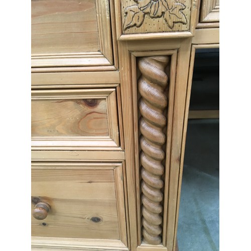 458 - Solid pine desk with 3 side draws and a central draw turned up supports and carved motif decoration ... 