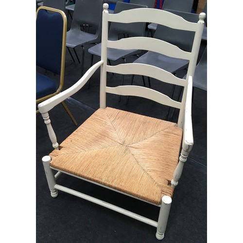 461 - Large rustic painted open arm chair with cane seat 100x78x63cm.